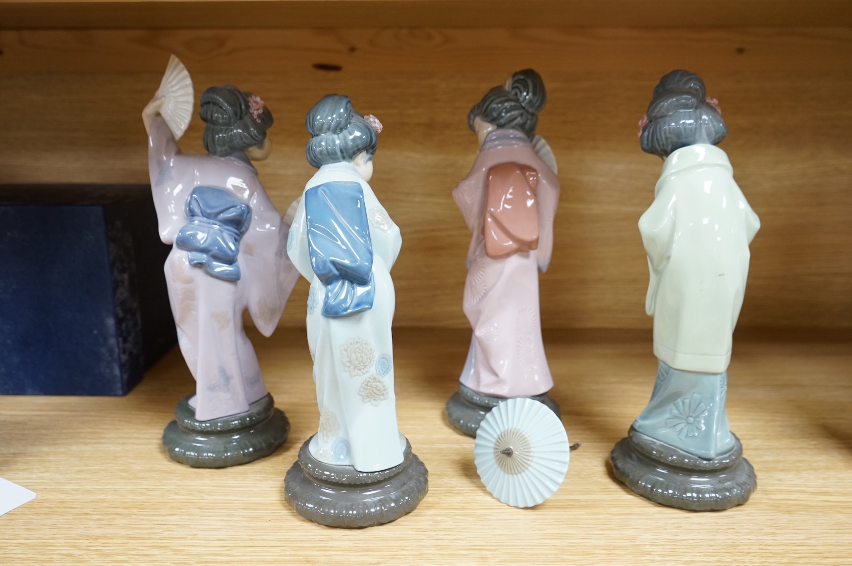 Four Lladro models of Geishas, tallest 30cm
